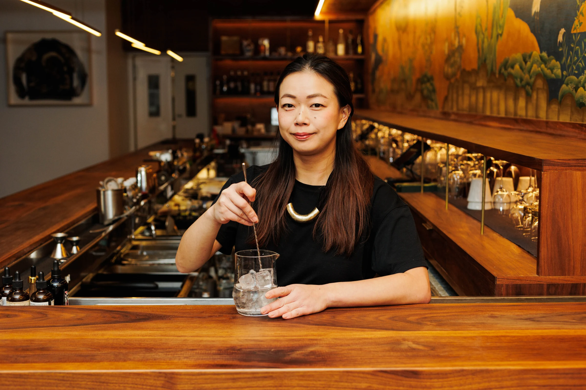 Koharu Usui at Bar Goto, crafting a drink with Japanese whisky.