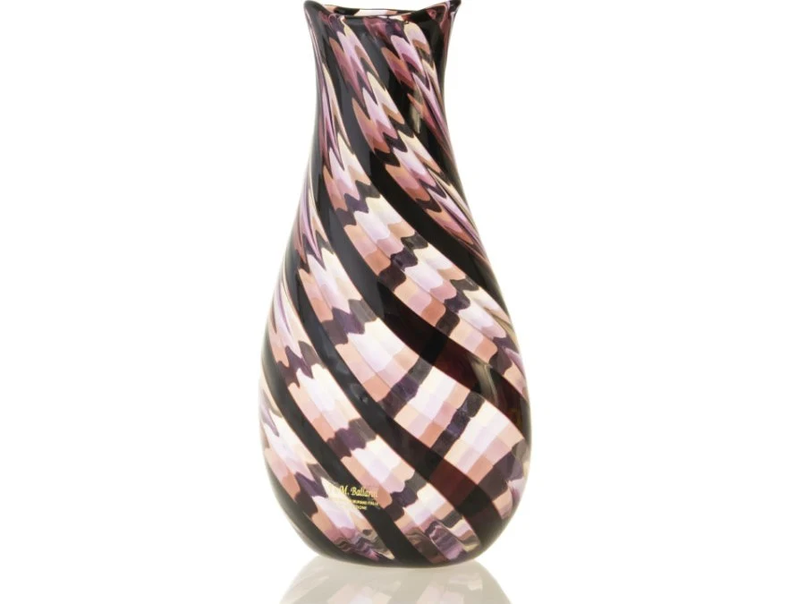 A Murano glass vase with a twisted cane filigrana technique, featuring diagonal stripes in pink, purple, and black.
