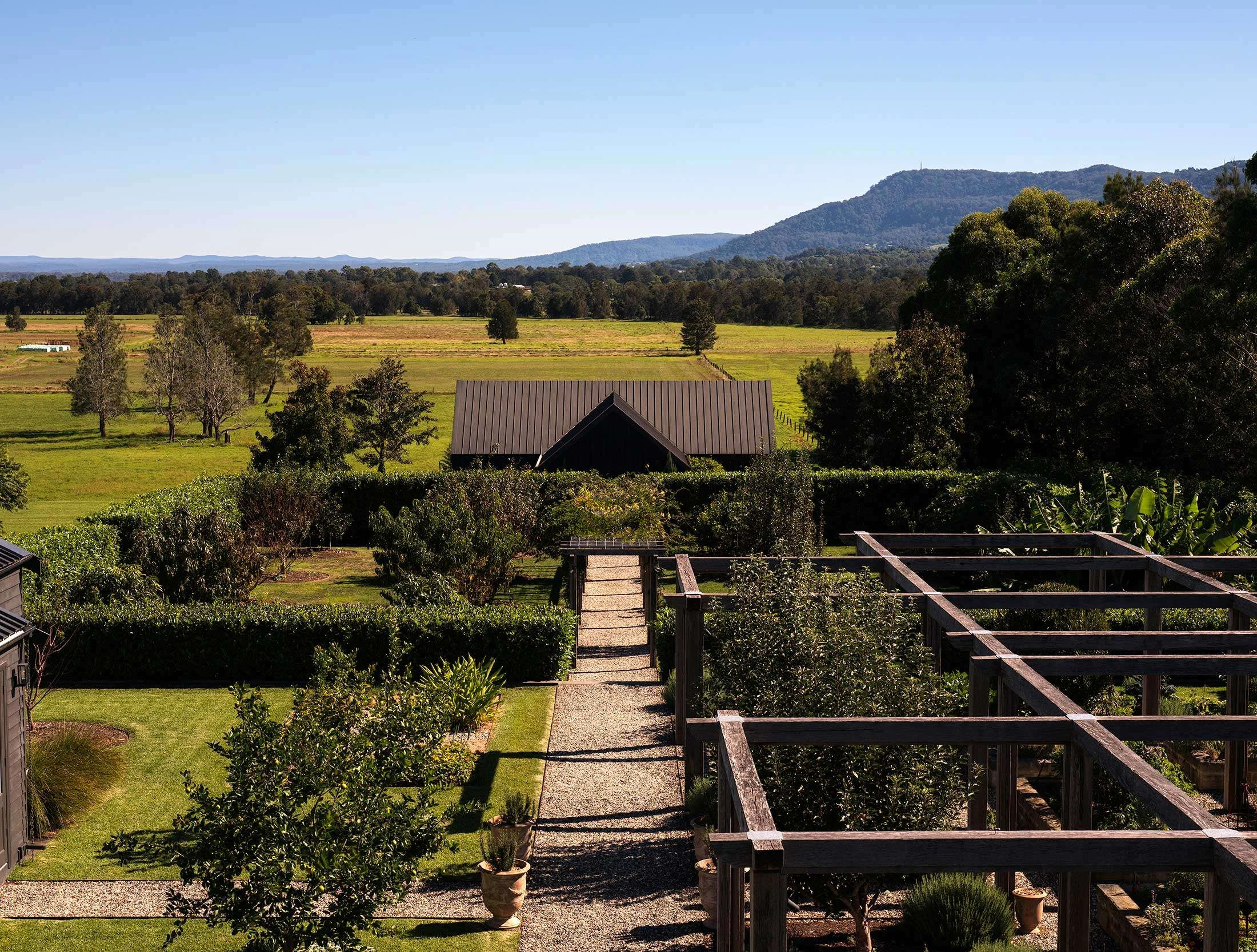 Moraea Farm Berry, future home of Sara Dining, offers a wide view of manicured gardens, fields, and the South Coast NSW landscape.