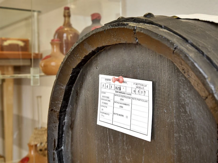 A data card records a barrel's history inside an acetaia in Modena.