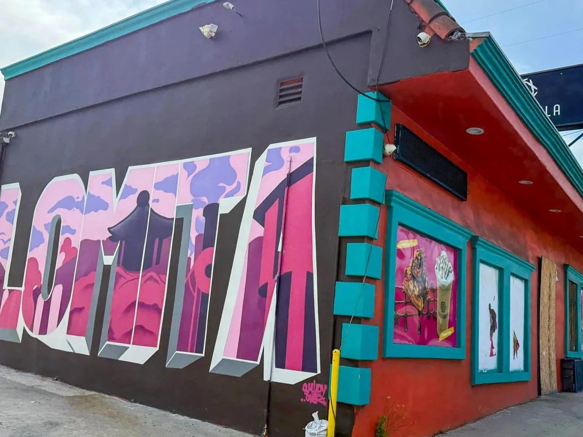 The mural and painted facade of the former churro shop at 26344 S. Western Avenue, soon to become Lomi Lomi.