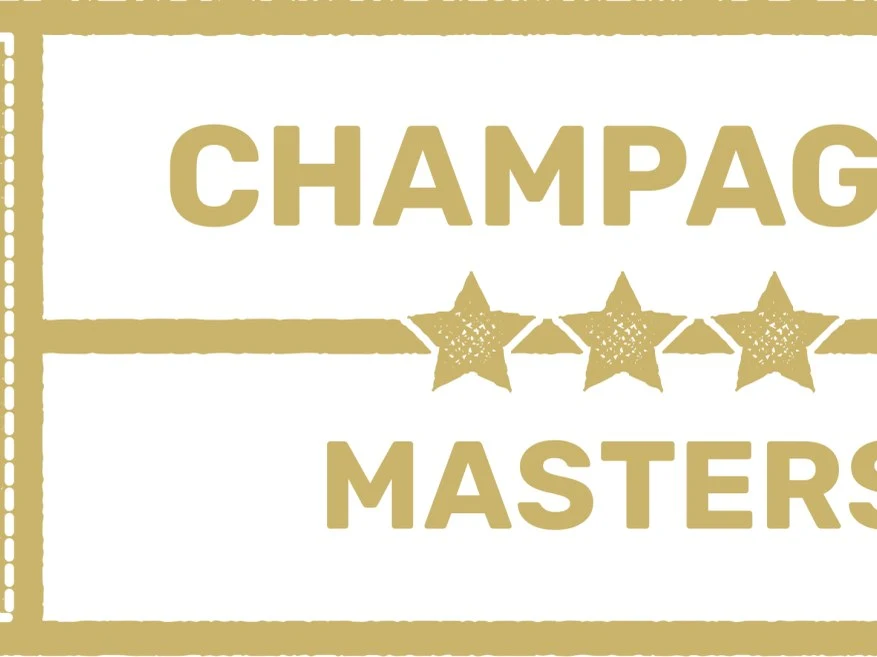 A gold and white Wine Scholar Guild Champagne Masters badge with three stars.