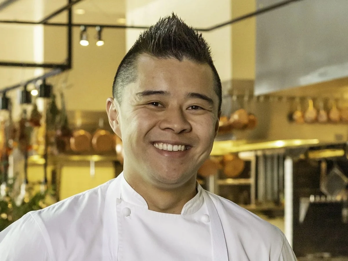 Richard Lee smiles in his chef's whites, ready to share his arte culinaria.