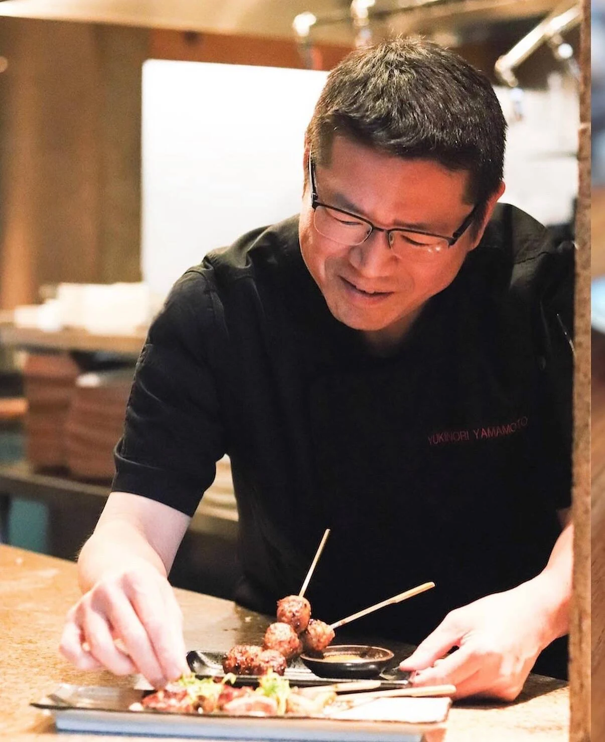 Yukinori Yamamoto plates dishes, showcasing his culinary skill.