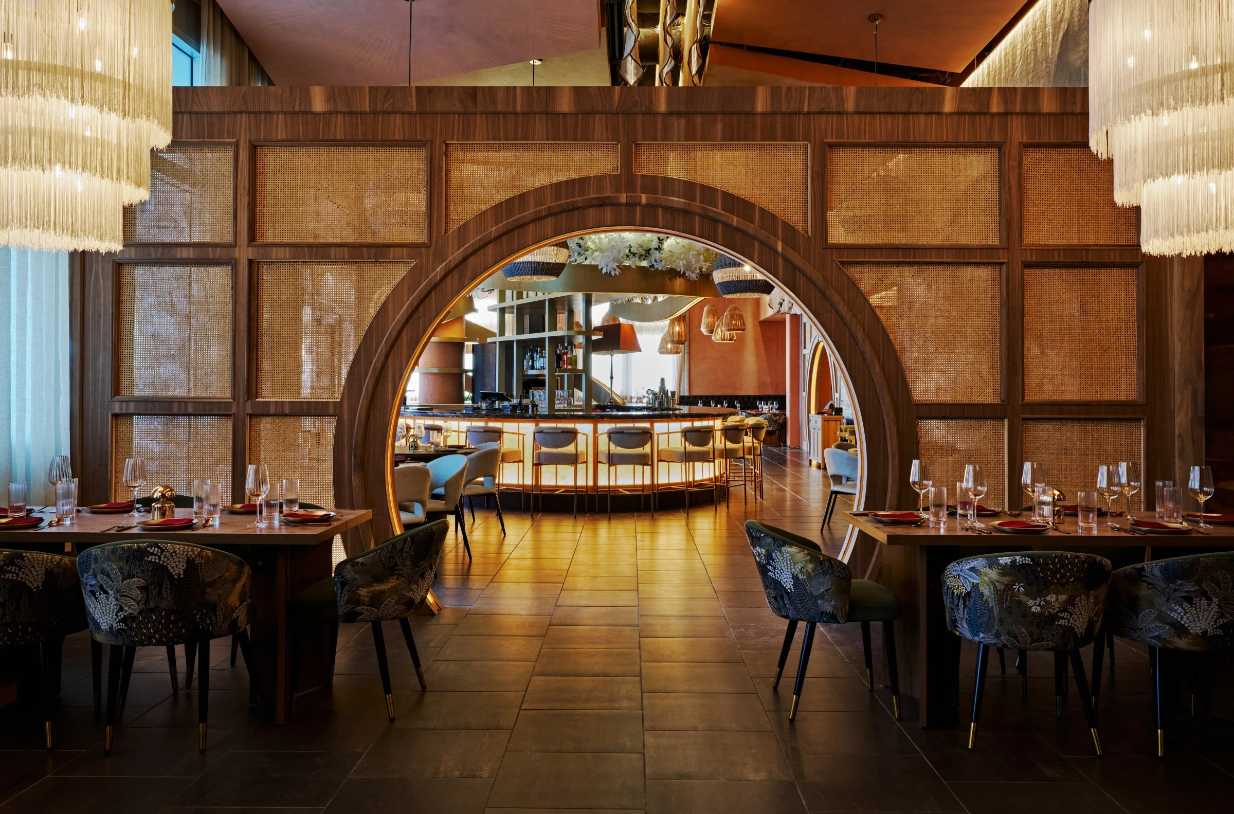 Ikara Atlantic Station's dining room features dramatic arched portals, cane panels, and celebratory design.