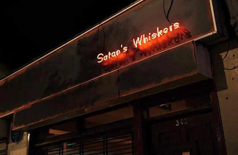 Satan's Whiskers in London, recognized by the Spirited Awards, glows at night.