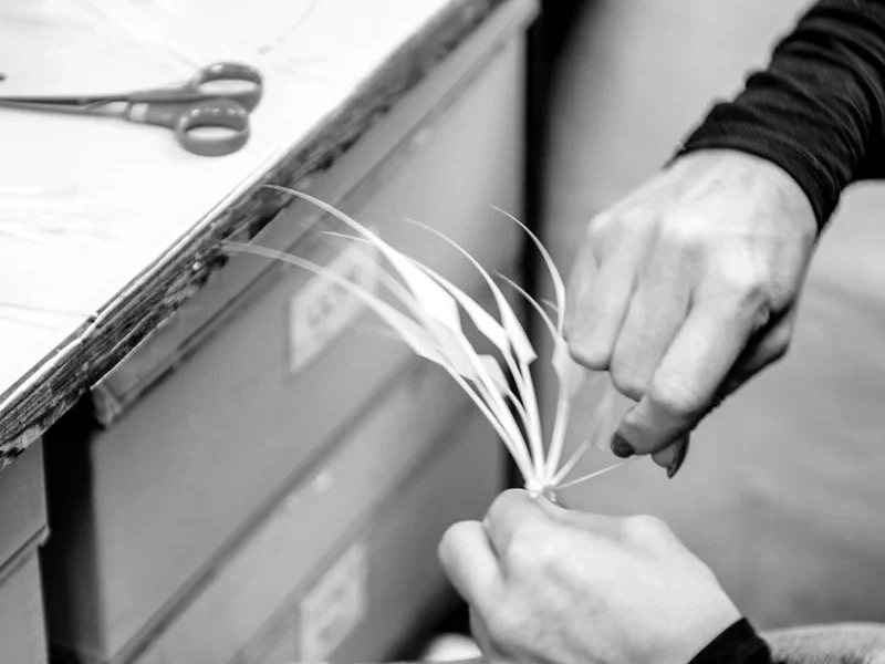 Bespoke hat makers craft fine materials, illustrating why their books close so quickly.