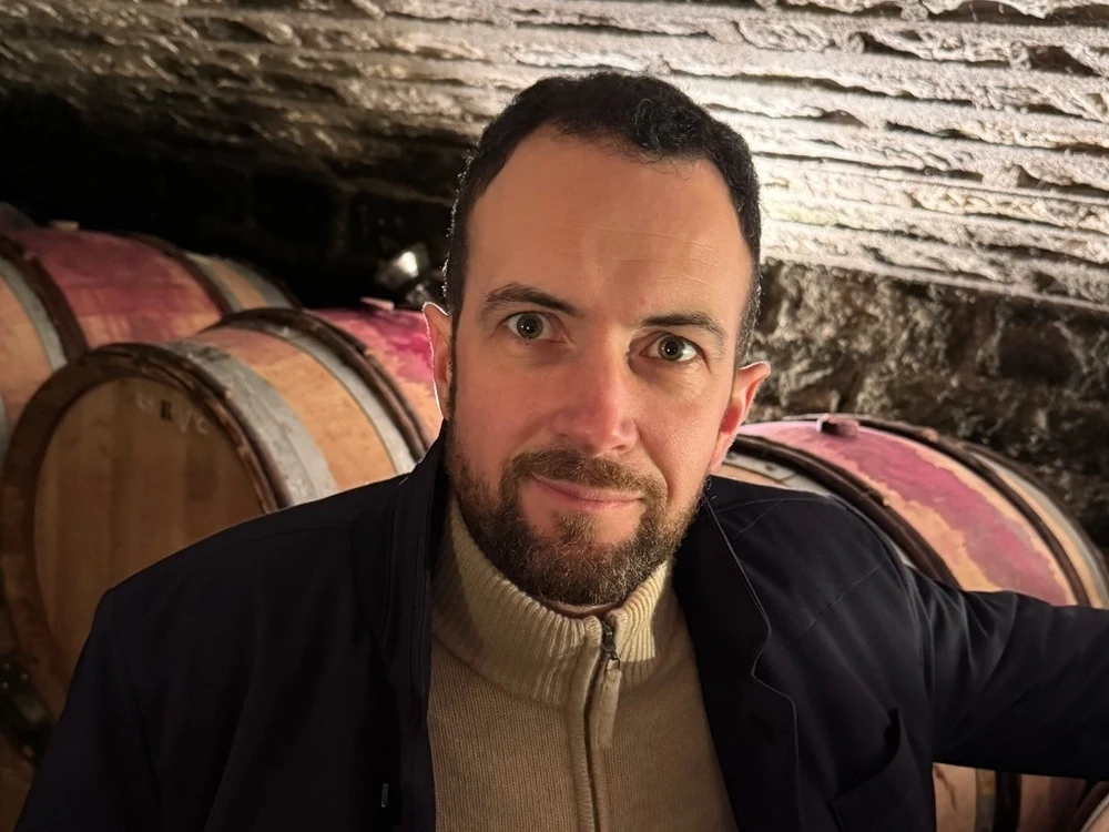 Raphaël Coche, who now leads Coche-Dury, in the domaine's Meursault cellar (via Kermit Lynch).