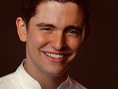 E.J. Lagasse smiles, the youngest two-star Michelin chef.