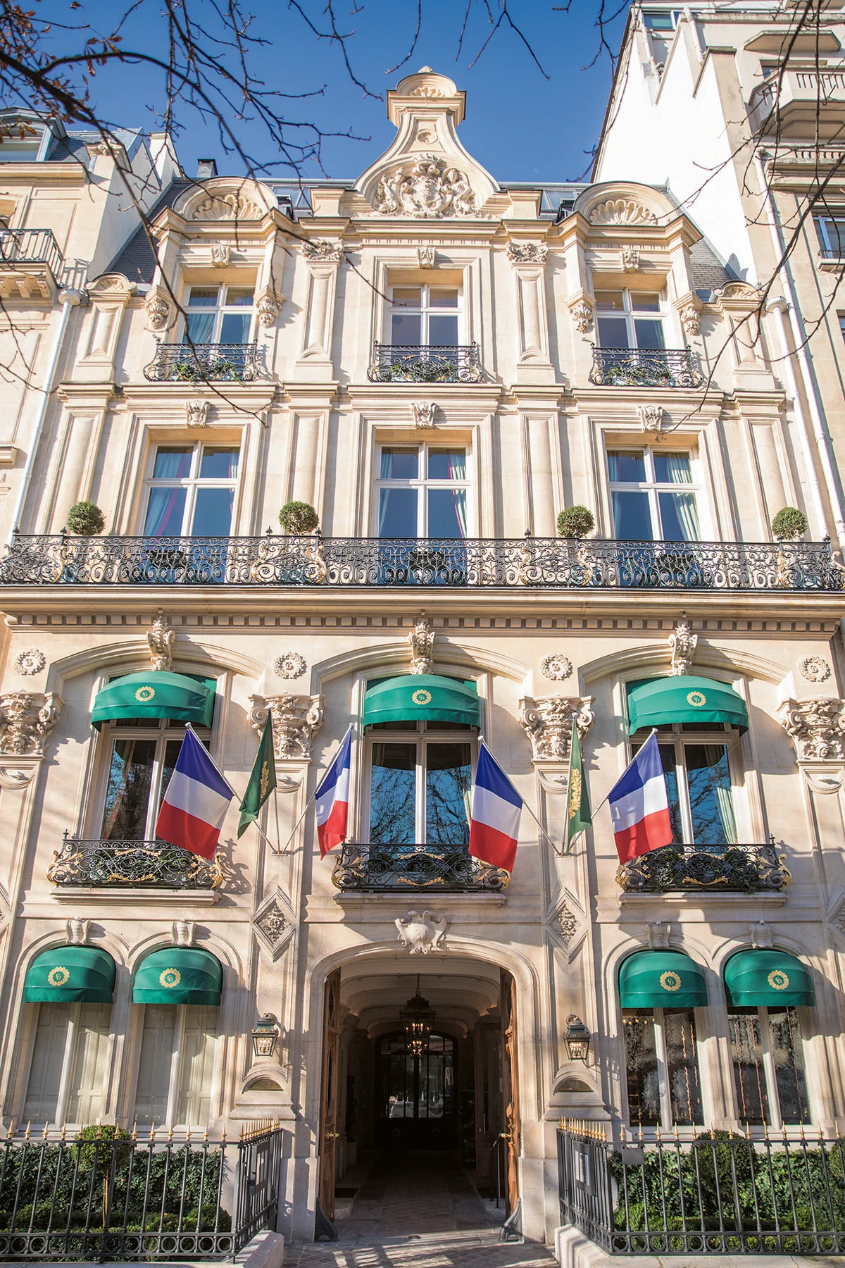 Domaine Clarence Dillon showcases its elegant facade with prominent green awnings.